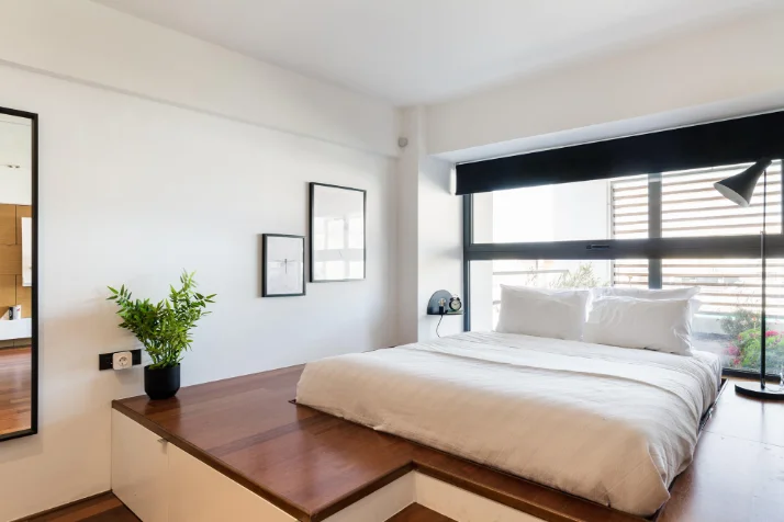 Freshly made hotel-grade bed at an Estiano residence